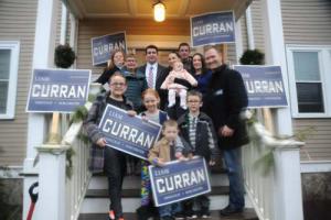 Liam Curran: The candidate, top center, is shown with a group of supporters recently. Curran, 33, is an attorney and former member of the Laborers Local 223. 	                  Photo courtesy Curran campaign